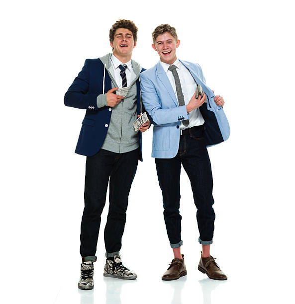 istock Cheerful brothers holding money 590247030