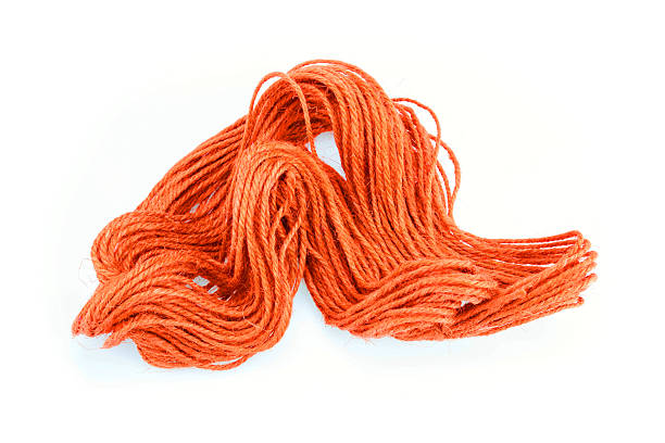istock Orange color ramie ropes on white background 590248288