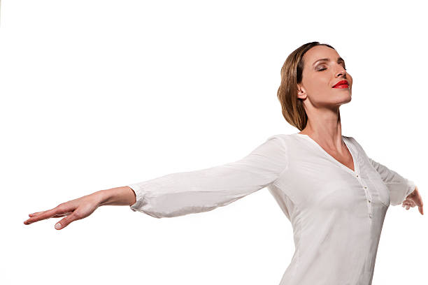 istock Beautiful young woman breathing in 590249126