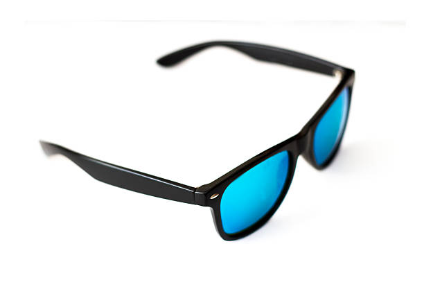 Prescription sunglasses with black, rubber frames and blue glasses stock photo