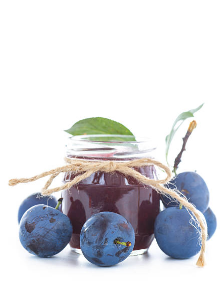 Red sauce for meat in craft glass bottles. Tkemali from plums