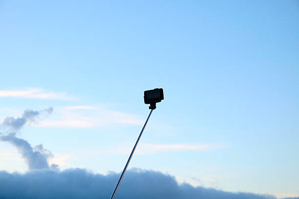 istock Selfie stick against the sky of Bali. 590252064