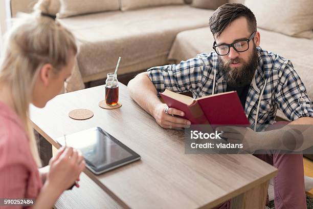 Reading Relaxation Stock Photo - Download Image Now - Adult, Apartment, Beautiful People