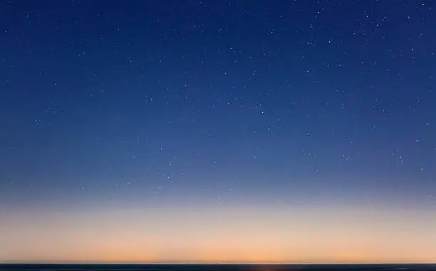 Sicily as seen on the horizon from Malta, on a clear and starry night.