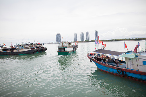 Sanya, China - July 5, 2016: Fishing boats at dock in Sanya in Hainan, South China Sea, China
