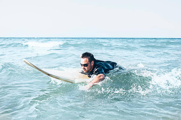 istock Man surfing in the sea 590256868