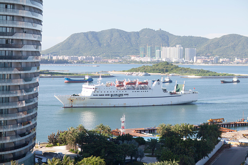 Sanya, Сhina - July 6, 2016: Cruise ship Beibu Wanzhi Xing (North Gulf Star) returning to Sanya from its weekly four-day cruise taking tourists around China's South China Sea assets