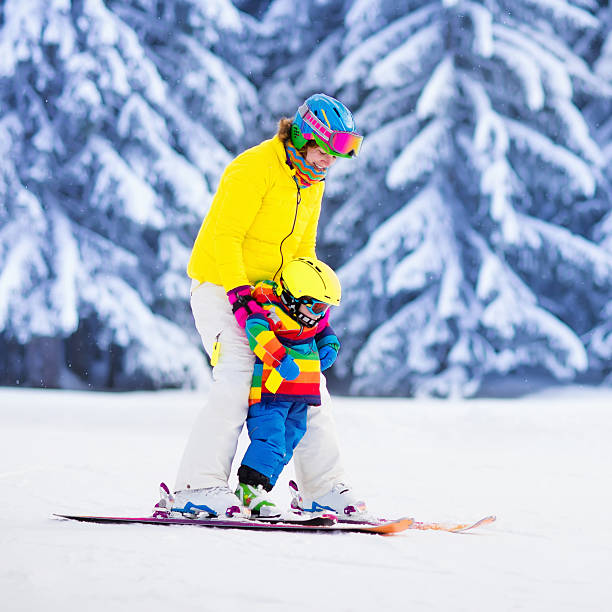 istock Mother and little boy learning to ski 590262284