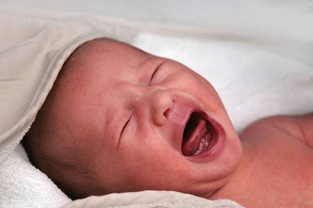 Crying Newborn Newborn baby crying after its first bath home birth photos stock pictures, royalty-free photos & images