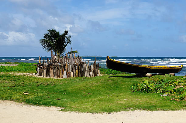 Central America, Panama, Traditional boat Kuna indians and homestead for animals on the San Blas archipelago