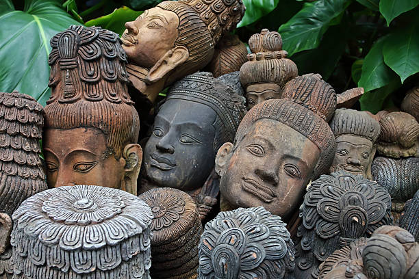 istock old terracotta Buddah heads 590264508