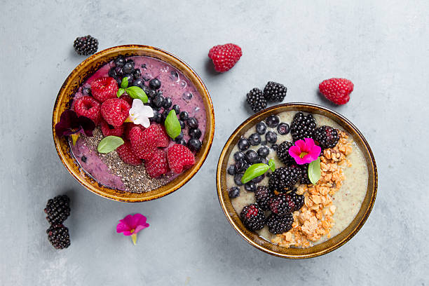 istock Breakfast berry smoothie bowl topped with berries, 590265008