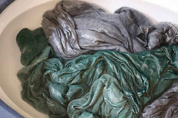 istock Damp Clothes, Manual Washing in the Sink. 590266034