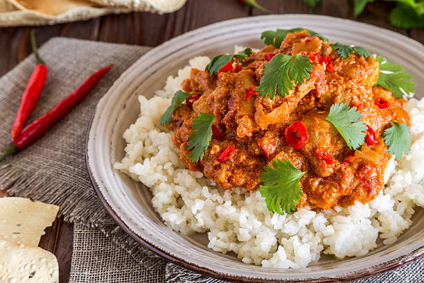 istock Chicken curry with rice and cilantro. 590266750
