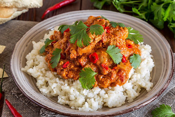 istock Chicken curry with rice and cilantro. 590266946