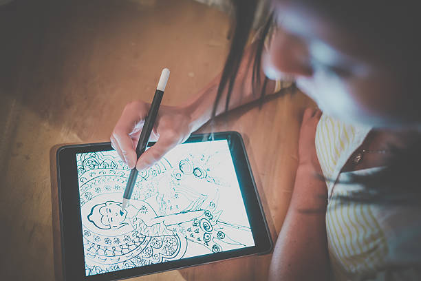 Female AdultDrawing Mandala on Electronic Tablet