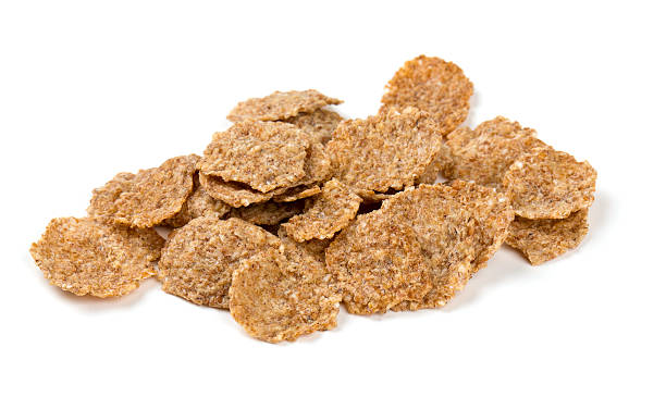 istock pile of bran flakes isolated on white 590269090