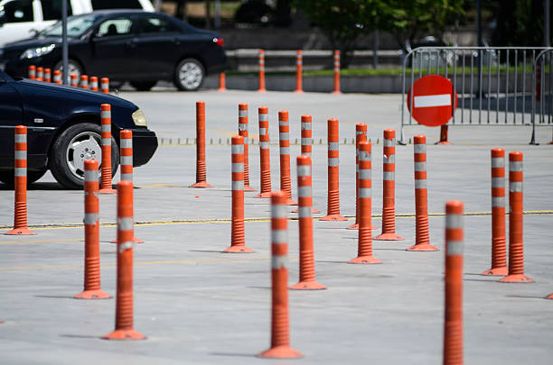 istock traffic cone, driving schools, road up 590272698