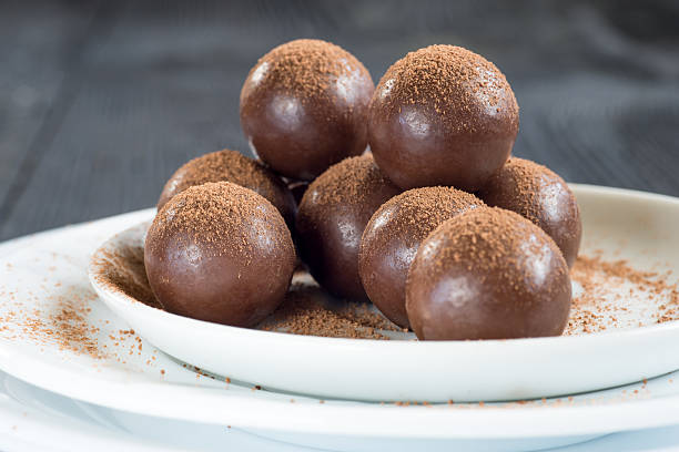 istock Assorted dark chocolate balls with cocoa powder 590276642