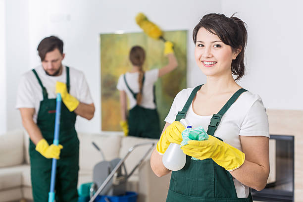 It's better to work in group Group of young hard working professional cleaners in dirty apartment hygiene stock pictures, royalty-free photos & images