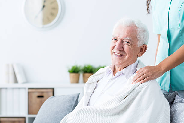 istock Happy senior man at nursing home 590278108