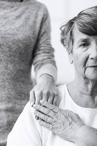 istock Elderly woman with mental illness 590281172