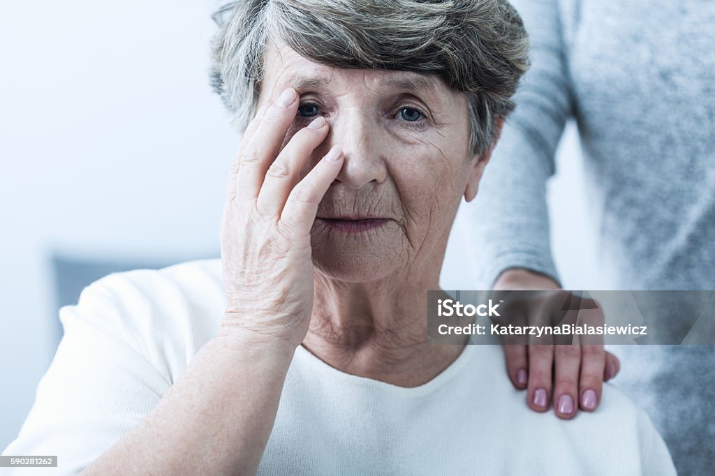 Woman suffering from senility Image of sad woman suffering from senility Alzheimer's Disease Stock Photo