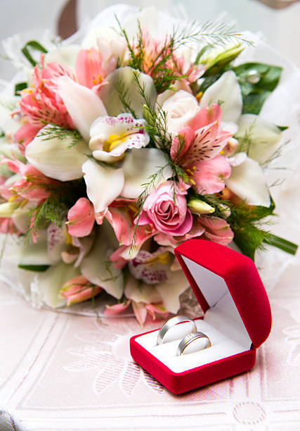 istock Wedding Ring in Red Box with Flower 590282346