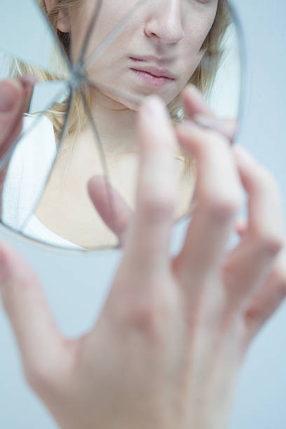 istock Depressed woman with schizophrenia 590282966