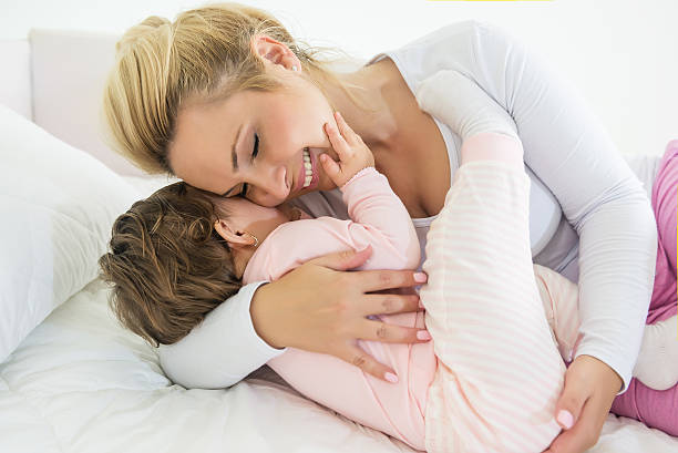 istock Mom and baby hug 590283106