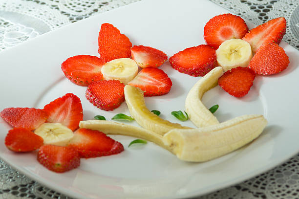 istock Composition of strawberries and bananas 590283484