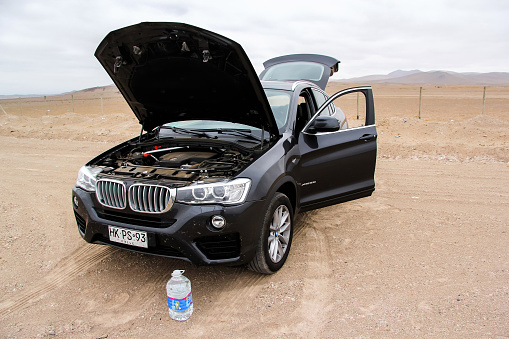 Copiapo, Chile - November 14, 2015: Motor car BMW F26 X4 with an opened bonnet is parked in the Atacama desert.