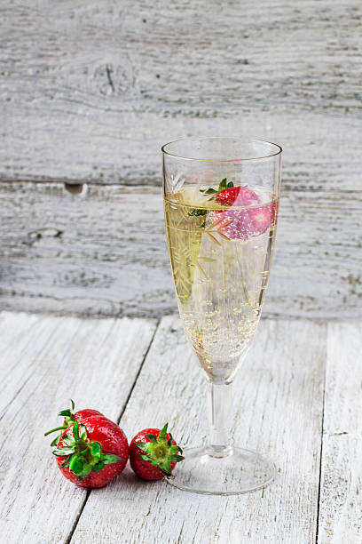 istock champagne glasses and strawberries 590285682