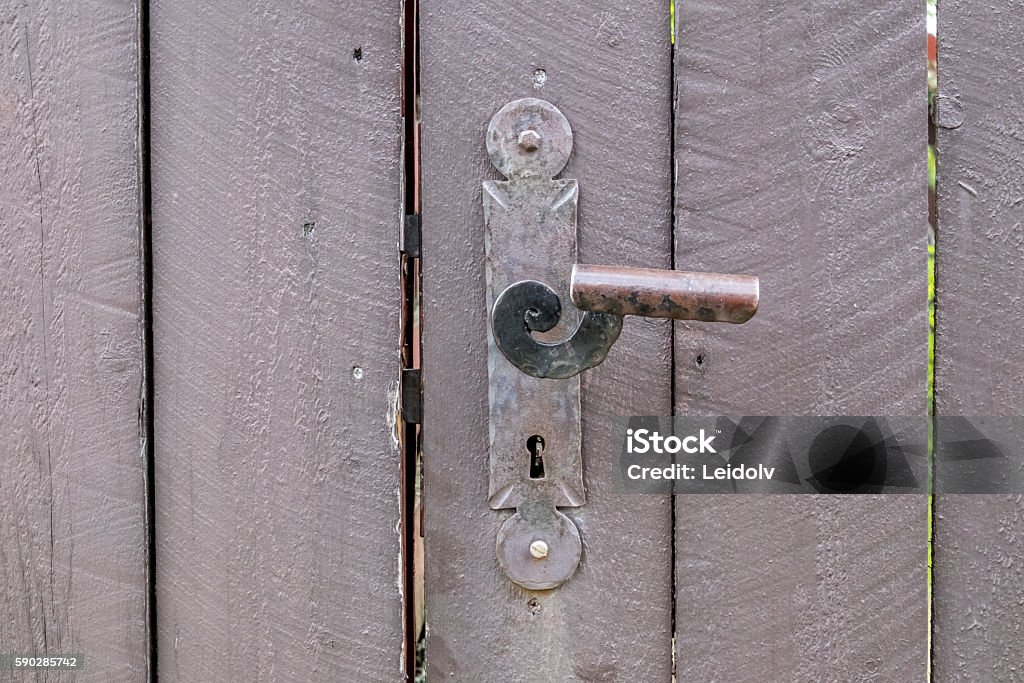 Door handle Wooden door in Røros, Unesco mining town.  Aging Process Stock Photo