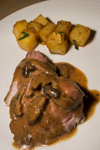 istock Lamb on a plate with sauce and potatoes 590287700