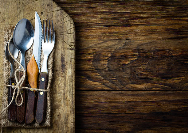 istock Autumn Halloween composition. Rustic set of cutlery knife, spoon, fork. 590288884