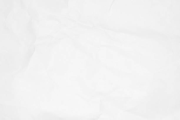 istock Crumpled white paper texture or paper background. 590291492