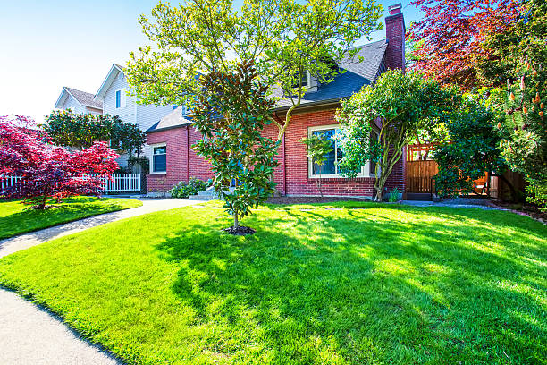 istock Red brick house exterior with well kept front garden 590293172