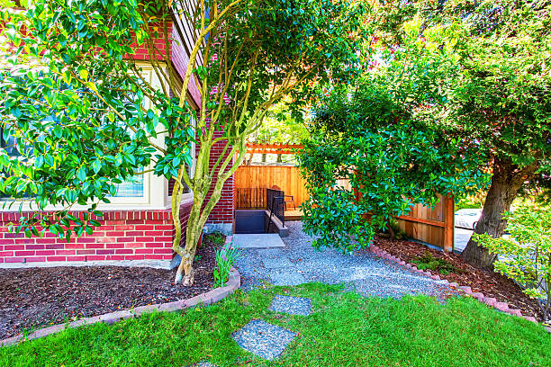 istock Red brick house exterior with backyard view. 590293394
