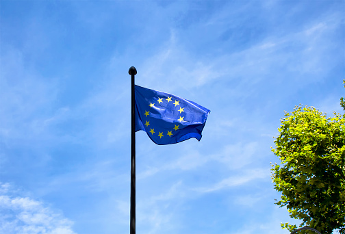 European Union flag with blue sky background in Paris