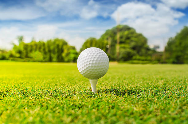 istock Close up of golf ball on tee 590297162
