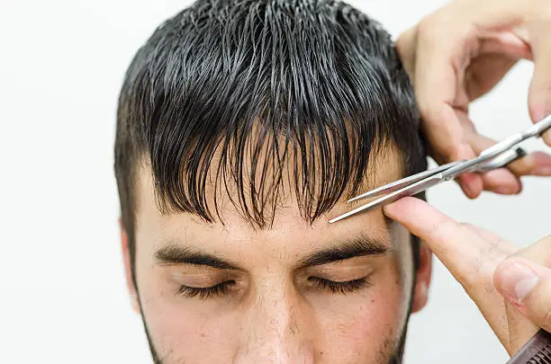 Photo of Hairdresser cut and shaped bangs