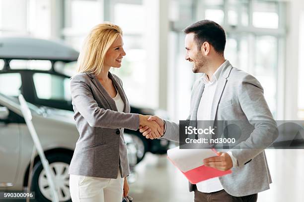 Customer Buying A Car At Dealership Stock Photo - Download Image Now - Selling, Car, Car Salesperson