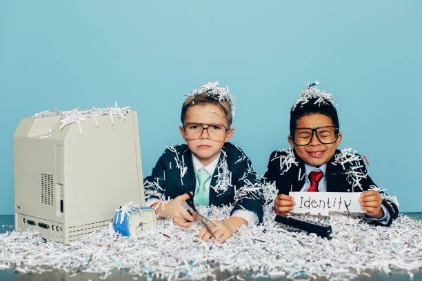 istock Two Young Businessmen Dressed in Suits at Office Desk 590300338