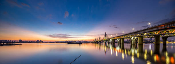 istock Blue Water Bridge Over   River Against Sky During Sunset 590301616