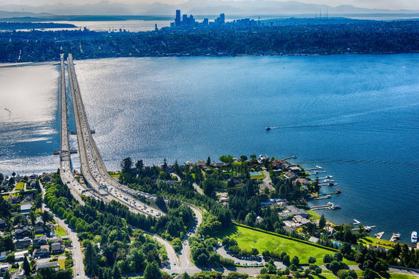 The skyline in the distance beyond Lake Washington and Interstate 90 crossing the lake shot from a helicopter at an altitude of about 400 feet.  