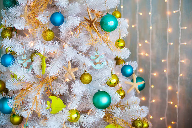 istock White decorative xmas tree with colourful balls, christmas concept 590302058