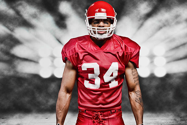 Football player in front of floodlighthttp://www.twodozendesign.info/i/1.png