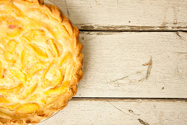 istock Peach Pie on Old White Wood Background 590303782