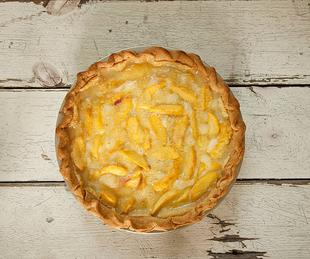 istock Peach Pie on Old White Wood Background 590303796